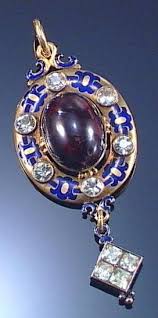 Enamel Garnet And Chrysoberyl Pendant 1870s In The Holbeinesque Manner Centring On An Oval Garnet Carbuncle Wi Victorian Jewelry Fine Jewels Antique Jewelry