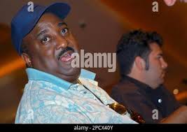 Darryl Knox, a regular at the IP Casino in Biloxi, Miss., talks about what  he describes as a family atmosphere at the casino, May 16, 2006. Knox and  Frank Fontenot, right, both