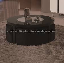 Founded on gleaming legs, this coffee table has two cylindrical ottomans with padded seats slide out from under the table when you need an extra seat. Black Round Coffee Table With Seating Underneath