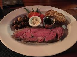 We don't tie our prime rib roast because it's not really necessary you can't go wrong with mashed potatoes or a baked potato for the starch, and asparagus or baked spinach for the vegetable. I Ate A Prime Rib With A Twice Baked Potato And Vegetables Food