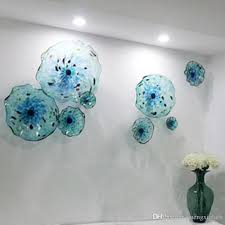 Exquisite colorful glass wall plates, sculptural glass wall art and glass wall flowers from white elk's visions in glass. 2021 Chihuly Style Murano Flower Glass Plates Wall Arts Blue Color Luxury 100 Hand Blown Glass Hanging Plates Irregular Wave Shape From Mengxiglass 804 83 Glass Wall Lights Glass Blowing Plate Wall Art