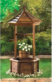 A decorative wishing well is always nice to have in the garden, as it adds unique appeal. Rustic Wishing Well Planter Rustic Outdoor Pots And Planters By Koolekoo