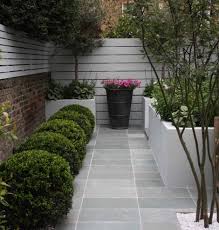 Blue Grey Limestone Paving For The Exterior Space Picks Up On Colour In The Adjacent Kitchen Interio Urban Garden Design Small Urban Garden Small Garden Design