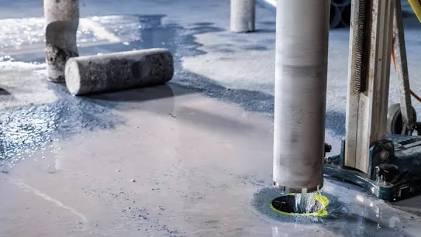 Industrial diamond core drilling machine creating accurate, clean penetrations through thick reinforced concrete (RCC), AI generated