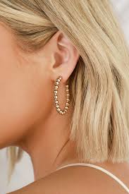 This would be a good choice the earrings are 2 to 2 1/2 in. Cute Gold Earrings Hoop Earrings Beaded Earrings Lulus