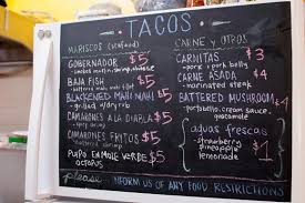 Baja fish tacos with chipotle mango salsa. It Takes A Village To Start A Taco Shop