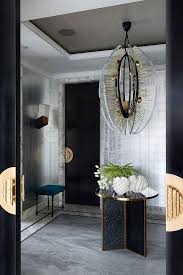 Below it is a midcentury, wood slat bench in teak that provides a place to sit or drop off handbags. The Most Popular Entryway Design Ideas On Pinterest Modern Entryway Decor Modern Home Interior Design Foyer Design