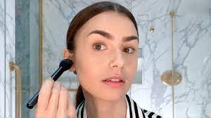 Watch Lily Collinss Understated French Girl Look | Beauty Secrets | Vogue