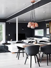 The '40s french dining chairs are upholstered in a lelièvre velvet, the shades are of a lee jofa silk and the rug is by the rug company. Copper Interiors Living Dining Room Finland Black Walls Copper Cluster Pendant Photo By Krista Keltanen 04 Erika Brechtel