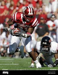 Indiana running back Trea Burgess (21) runs out of the tackle of Arkansas  State cornerback Adrian Hills during the fourth quarter of an NCAA college  football game in Bloomington, Ind., Saturday, Oct.