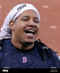 Red Sox left fielder Manny Ramirez rounds the bases after hitting a home  run off New York Yankees pitcher Randy Johnson, also sending Kevin Youkilis  home during the first inning at Fenway