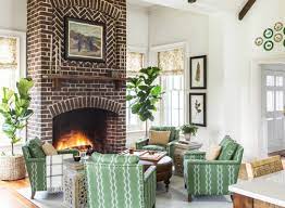 Furnishings include a sofa set and a pair of armchairs with a coffee table. 58 Fireplace Ideas 2021 Best Fireplace Designs In Every Style