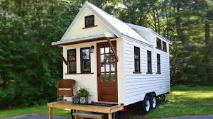 Stunning White Farmhouse Style Tiny House On Wheels Tiny Farmhouse Tiny House Exterior Tiny House On Wheels