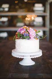 Simple White Cake With Flowers On Top Flower Cake Floral Cake Wedding Cakes