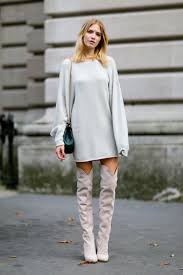 We don't need to tell you that, for women at least, the camel coat will never date. 10 New Ways To Style Your Over The Knee Boots The Everygirl
