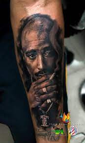 This tattoo specifically symbolized black unity. 46 Tupac Tattoos Catanicegirl