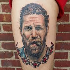 The life events this design is devoted to are tom hardy's two famous movies — the dark knight rises and mad max. 10 Intense Tom Hardy Tattoos Tattoodo