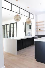 Black Steel Transom Modern Kitchen With Black Cabinets Double Islands Get Your Free African In Black Kitchen Cabinets Modern Kitchen Design White Oak Kitchen