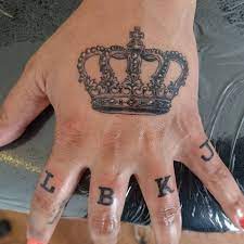 Crowns are often part of matching couple tattoos, where a boyfriend and girlfriend or husband and wife get a king and queen tattoo design to celebrate their relationship. Crown Tattoos For Women On Hand Novocom Top