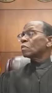 A judge in Michigan was incredulous after a man charged with a suspended  license appeared at a virtual court hearing while driving. See what  happens: