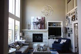 My New Gray Living Room Is Finally Done Gallery Wall Off Center Fireplace Orb Chandelier Off Center Fireplace Living Room With Fireplace Living Room Style