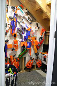 My son and his friends love having nerf battles in the neighborhood park, and we've collected quite the armory over the years! Easy Diy Nerf Gun Storage From Thrifty Decor Chick