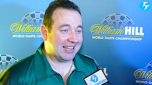 Brendan Dolan defeats Nolan Arendse in a 3-0 win in the first round of the  World Darts Championship.