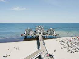 Binz is the largest seaside resort on the german island of rügen. Germany Ruegen Binz People In Beach Booth At Island Of Rugen Sky Outdoor Chair Stock Photo 182492188