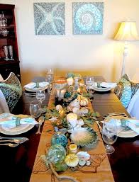 This unique pillar candle holder can be used as an accent piece on any table top or as a centerpiece for the coffee table, dining table, alter, or mantel. 20 Festive Coastal Table Top Centerpiece Ideas With Candles Coastal Decor Ideas Interior Design Diy Shopping