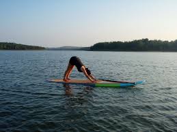 Downward Facing Dog With Lotus Sup Tulsa Ok Downward Facing Dog Surfboard Yoga