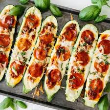 Pizza Stuffed Zucchini Boats Make Vegetarian Pizza Version Also Fill With Marinara Sauce Roasted Red Peppers Zucchini Zucchini Boat Recipes Pork Zucchini