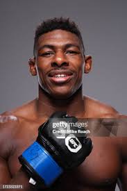 Bobby Green poses with his team after defeating Grant Dawson in a... News  Photo