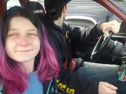 Someone is comfortable in the back seat