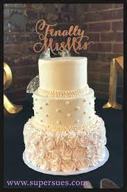 Delicate Ivory And Light Pink Three Tiered Wedding Cake Buttercream Roses And Pearls Wedding Cake Pearls Pink Wedding Cake Wedding Cake Decorations