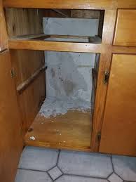 With the cabinets on the floor, align the face frame of the upper corner cabinet so it's flush with the frame of the neighboring cabinet. Wall Damage Behind Kitchen Cabinets Homeowners