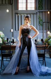 Blush floral wedding dress with a bow on the back. Striking Purple Black Gold Wedding Decor Ideas