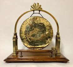 Large gong in timber stand, with decorative carved figures to both sides, height 77 cm. Large Antique Brass Tabletop Dinner Gong 637306 Sellingantiques Co Uk