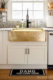 His string10 design, with a cluster of bulbs at the bottom, for example, starts at $175. Modern Timeless Organic Kitchen Reveal It S Finally Here Brass Sink White Modern Kitchen Organic Modern Decor
