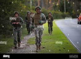 U.S. Marine Corps Sgt. Darian Jacobs, data systems administrator,  Headquarters and Headquarters Squadron (H&HS), Marine Corps Air Station  Beaufort, runs to an obstacle at the combat endurance course for the H&HS  Squadron