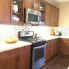Try light gray or blue shaker cabinets, forego the hardware and add sleek white quartz countertops. 3