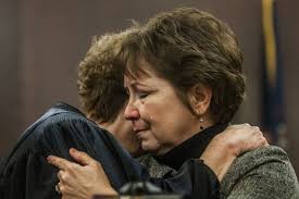 Judge honors first two graduates of Genesee County's veterans court program 