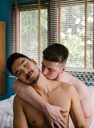 Man Kissing Another Man on the Neck · Free Stock Photo
