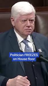 A politician froze mid-sentence after he suffered a medical emergency while  delivering a speech