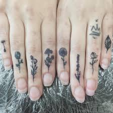 We Love Flower Tattoos So We Came Across These Tiny Floral Tattoos That Make Up A Flower Garden We Were 100 On Board Th Tattoos Finger Tattoos Tiny Tattoos