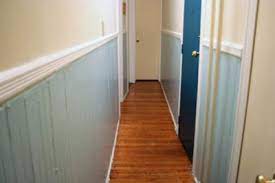 The idea is to visually create a more spacious walkway. Breaking Up A Narrow Hallway With Paint Colors