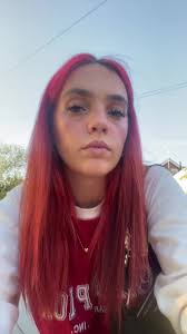 Leaning ona Wheelie bin