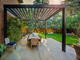 There are a number of outdoor pergola lighting options that can hang down from the cross beams.a fan with a light fixture could be hung from the ceiling. Modern Steel Beam Pergola With Hanging Light Pendants And Dining Table Hgtv