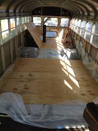 Sub Floor Being Installed Tar Paper 2x1 Framing Insulation Sealed Connected With Duct Tape Plastic Vapor Bar School Bus Conversion Bus House Camper Living