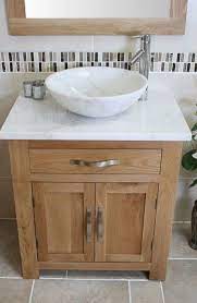 Solid wood or solid hardwood vanities cost more but are usually stronger and available in more details designs such as hand carvings seen in antique, country, and transitional bathroom cabinets. Pin By Carla On Bathroom Oak Bathroom Vanity Oak Bathroom Bathroom Sink Units