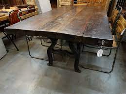 Choose the dining room table design that defines your family's style and character. Wooden Dining Table Features A Black Cast Iron Base